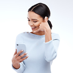 Image showing Phone call, sign and woman isolated on a white background for networking, contact and communication on mobile app. Happy young person talking, hello or conversation on cellphone service in studio