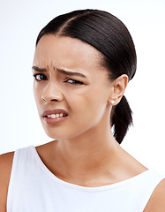 Image showing Confused, portrait and woman in studio with attitude, annoyed and unsure against white background. Wtf, face and frustrated girl with doubt, contemplating and thinking emoji, pensive and offended