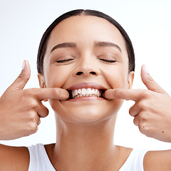 Image showing Dental, woman and mouth care in studio for teeth whitening, hygiene and treatment on white background. Oral, cleaning and girl happy with invisible braces, veneers and tooth implants procedure