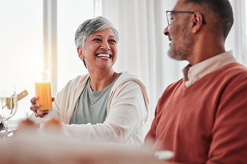 Image showing Happy, elderly and a couple talking at breakfast, laughing at a joke and enjoying juice together. Smile, morning and a senior man and woman enjoying a lunch while speaking and bonding at home