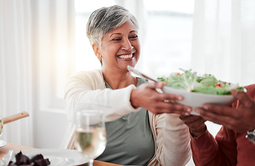 Image showing Family dinner, senior woman and salad of a happy female with heathy food in a home. Celebration, together and people with unity from eating at table with happiness and a smile in a house giving meal