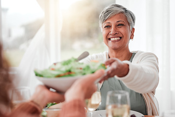 Image showing Family dinner, senior woman and healthy salad of a happy female with food in a home. Celebration, together and people with unity from eating at table with happiness and a smile in a house giving meal