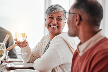 Image showing Happy, smile and couple at lunch in family home, drinking wine and laughing at jokes. Conversation, together and a man and woman speaking with a drink during a dinner with friends in a house