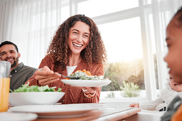 Image showing Family dinner, happy woman and salad with children at home for nutrition. Celebration, together and people with kids eating at table with happiness and a smile in a house giving lunch on plate