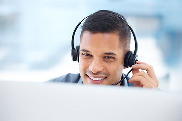 Image showing Call center, headset or friendly man in communication at telecom customer services on microphone. Smile, crm office or happy sales agent consulting, speaking or talking in technical support help desk
