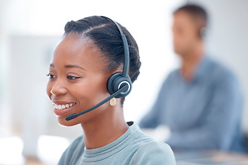 Image showing Call center, headset or friendly black woman in communication at telecom customer services. Microphone, smile or happy African sales agent consulting, speaking or talking in tech support help desk