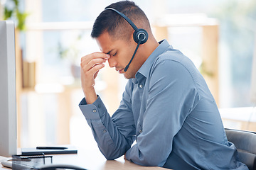 Image showing Headache pain, tired or man in call center with burnout feeling overworked in crm communication. Migraine, office or stressed telemarketing sales agent with anxiety, fatigue or mental health problems