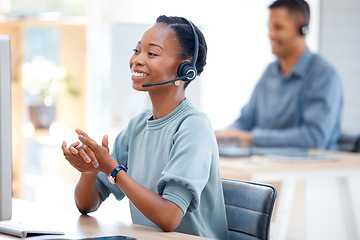 Image showing Call center, smile or friendly black woman in communication at telecom customer services office. Microphone, crm or happy African sales agent consulting, speaking or talking in tech support help desk