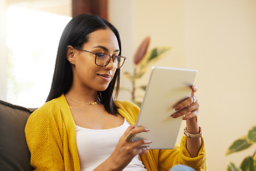 Image showing Tablet, relax and woman reading in home living room on sofa, social media or ebook. Technology, touchscreen and happy person web scrolling, online browsing or streaming video, movie or film in lounge