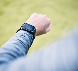 Image showing Hand, closeup and smartwatch for fitness, time and track progress after training, workout and practice. Person, athlete and runner with device, timing and exercise for wellness, heart rate and cardio