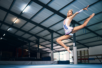 Image showing Dance, jump and a woman in gymnastics practice, artistic hobby and competition for sport. Fitness, creative and a female gymnast practicing a routine, jumping and dancing for a sports performance