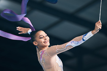 Image showing Ribbon gymnastics, happy woman and dancing in performance, training show and sports competition. Female, rhythmic movement and dancer smile for action, creative talent and energy for concert in arena