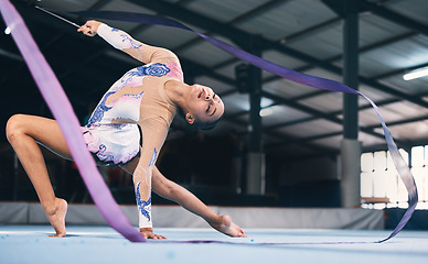 Image showing Ribbon, gymnastics and flexible woman stretching in performance, dance training and sports competition. Female, rhythmic movement and dancing athlete for creative skill, talent and concert in arena