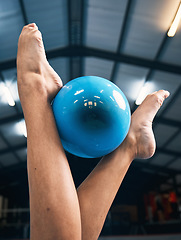 Image showing Gymnastics, woman and feet with ball for competition, dance practice and sports training. Closeup of barefoot female gymnast, balance and equipment for agility, creative skill or performance in arena