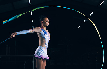 Image showing Ribbon gymnastics, woman and serious dancer in talent show, competition and dark mockup arena. Focused female athlete, rhythmic movement and dancing solo performance, creative sports or concert event