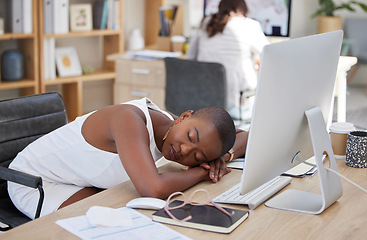 Image showing Office, sleeping or tired black woman resting on table with burnout is overworked by deadlines at desk. Lazy, dreaming or exhausted worker with stress or fatigue napping on relaxing break in overtime