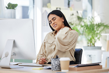 Image showing Tired, office or woman with neck pain injury, burnout or bad ache at a business or company desk table. Posture problems, muscle tension or injured female worker frustrated or stressed by emergency