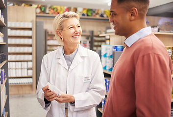 Image showing Man shopping, medicine or happy pharmacist in pharmacy for retail healthcare information with a smile. Trust, woman or senior doctor helping a customer with medication advice, pills or medical drugs