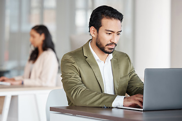 Image showing Focused business man typing on laptop at office desk, planning information and digital tech project. Male employee working on computer for data update, website strategy and research for online report