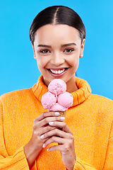 Image showing Happy, ice cream and portrait of woman in studio for summer, snack and sweets. Smile, happiness and sugar with female eating frozen gelato on blue background for dessert, junk food and diet mockup