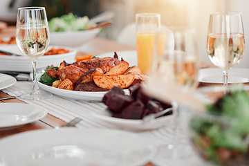 Image showing Food, party and celebration with table in dining room for event, thanksgiving and gathering. Nutrition, diet and cuisine with meal and wine at home for sharing, community and Christmas dinner