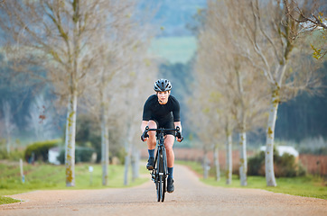 Image showing Cycling, fitness and cardio with woman in park for training, workout and health. Exercise, travel and freedom with female cyclist riding on bike in nature for adventure, journey and transport