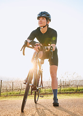 Image showing Rest, cycling and fitness with woman in nature for training, workout and sports cardio. Health, relax and thinking with female cyclist riding on bike in outdoor for exercise, endurance and challenge