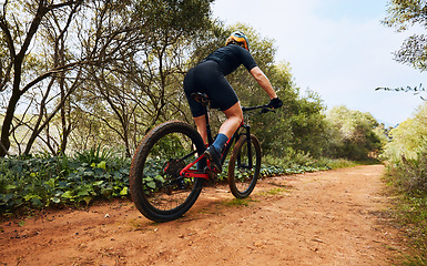 Image showing Sports, fitness and cycling with woman on dirt path in nature for workout, training and competition. Strong, cardio and exercise with female cyclist riding on mountain bike for adventure and journey