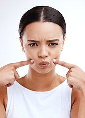 Image showing Frown, portrait and woman in studio sad, disappointed and unhappy against white background. Frown, upset and hands on face of girl with negative emotion, confused or doubt while posing isolated