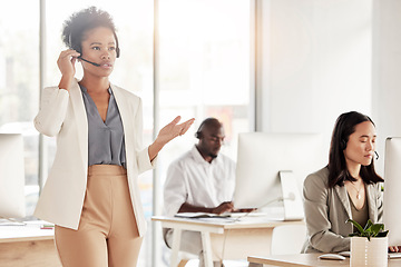 Image showing Call center, black woman and business communication in office, coworking sales agency and customer service. Female telemarketing agent talking on headset for help, crm advisory and telecom support