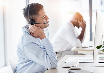 Image showing Neck, pain and stress of man in call center, joint inflammation and tired advisor in business office. Frustrated telemarketing agent, injury and muscle risk of burnout, problem or bad posture at desk