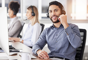 Image showing Portrait, call center and customer service with a man consulting using a headset in his support office. CRM, contact us or telemarketing with a male consultant working in an agency for communication