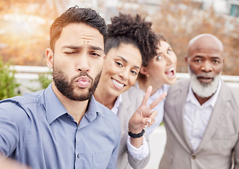 Image showing Business, team and crazy selfie outside with kiss, peace sign and happiness working together with diversity. Success, smile and employees taking outdoor group picture to celebrate achievement or goal