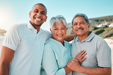 Image showing Happy, hug and a portrait of a family at the beach for bonding and quality time on the weekend. Smile, relax and a senior mother and father hugging with an adult man during a holiday at the sea