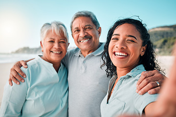 Image showing Senior parents, daughter and beach selfie with smile, hug and happiness in summer sunshine for social media. Women, man and portrait with happy, excited face and profile picture with love on holiday