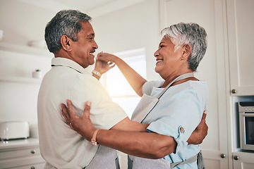 Image showing Love, cooking and senior couple dancing in the kitchen together feeling happy, exited and bonding in a home. Care, happiness and romantic old people or lovers dance enjoying retirement in a house