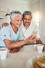 Image showing Phone, video call and elderly couple in a kitchen happy, smile and embrace in their home. Smartphone, love and old people pose for selfie, photo or profile picture while enjoying retirement together