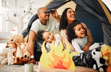 Image showing Family, living room and tent with children, games and toys for bonding, love and playing together. Parents, girl kids and laughing with mom, dad or camping game in home with happiness on lounge floor