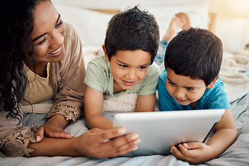 Image showing Tablet, education and a mother with her children on a bed at home in the morning together for entertainment. Family, boy or brother with a woman and her kids learning online in the bedroom of a house