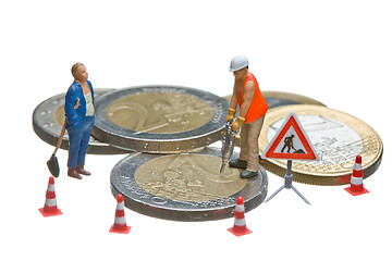 Image showing Miniature figures working on a heap of Euro coins.