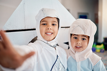 Image showing Selfie, costume and playing with children at home for astronaut, halloween and fantasy. Happy, smile and picture with kids in spacesuit in play room for imagination, photography and siblings