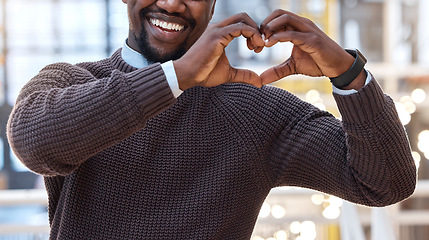 Image showing Hands, heart and black man showing love gesture, sign or symbol feeling happy, support excited in an office. Care, employee and businessman with loving or hearty shape, emoji and icon at work