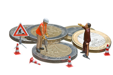 Image showing Miniature figures working on a heap of Euro coins.