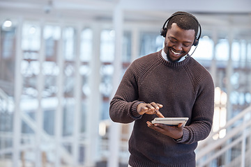 Image showing Call center, tablet and happy black man in office for working, customer support or consulting. Telemarketing, contact us and technology of African person, sales agent or consultant online for service