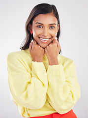 Image showing Happy, smile and portrait of a woman in a studio with a casual outfit and positive mindset. Happiness, excited and face of a stylish Indian female model with fashion isolated by a gray background.