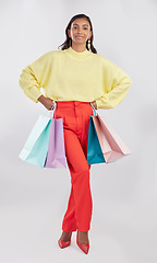 Image showing Portrait, fashion and woman with bags, shopping and glamour against a white studio background. Face, female shopper or model with products, elegant person and holding gifts with smile, brand and sale