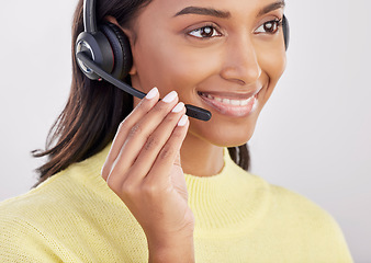 Image showing Woman is happy, face with callcenter and headset with mic, CRM and contact us with consultant on studio background. Indian female smile with customer service agent and help desk with tech support