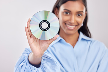 Image showing Woman, compact disk and smile in studio portrait for programming, software and information technology. Young indian girl, cd and happy with movie, music and data storage for media by white background