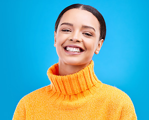 Image showing Happy, face and portrait of woman in studio for relax, beauty and natural makeup. Cosmetics, fashion and happiness with Latino female isolated on blue background for glow, cool and satisfaction
