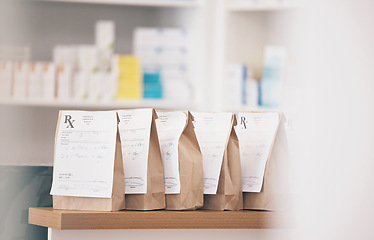 Image showing Healthcare, pharmacy and prescription medicine in paper bag, product and pills at counter of drugstore service. Pharmaceutical background, empty retail dispensary and medical supplements in package